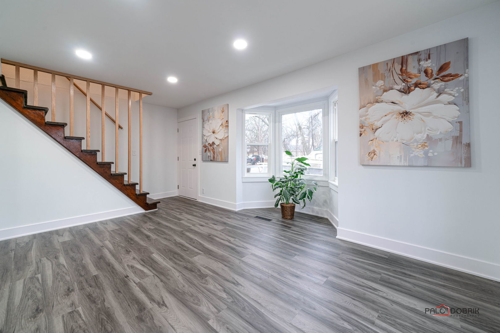 38236 North Lee Avenue Spring Grove, IL 60081 - Photo 5 of 25 a view of an hallway with wooden floor and a potted plant