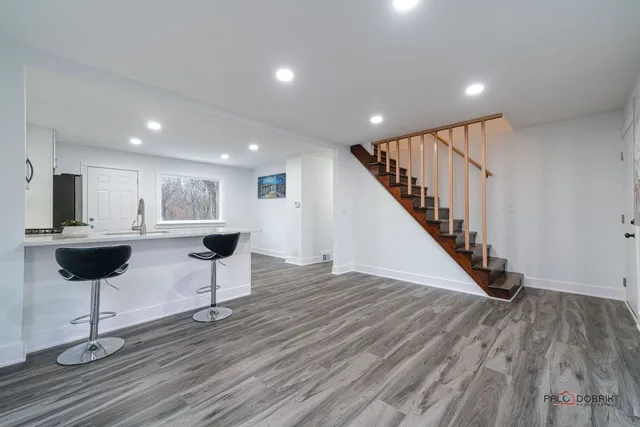 a kitchen with stainless steel appliances a refrigerator stove and microwave