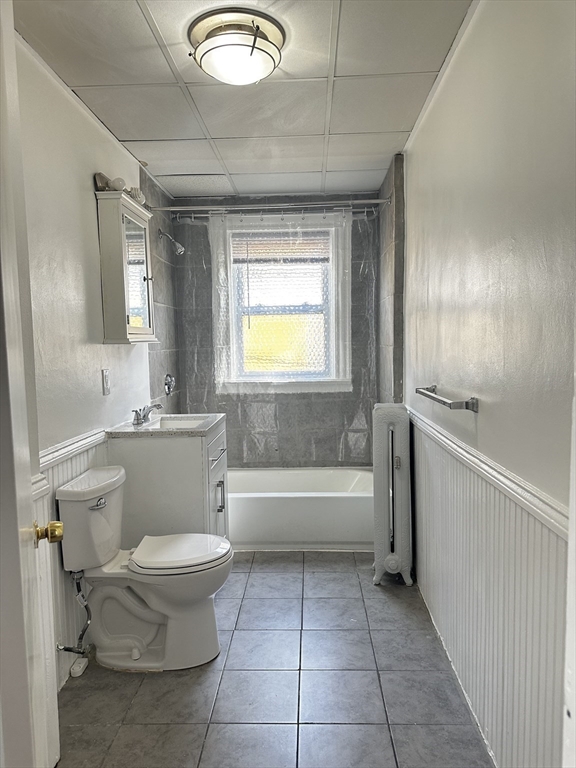 4 Howard Avenue, Unit 2 Attleboro, MA 02703 - Photo 14 of 17 a bathroom with a toilet a sink and bathtub