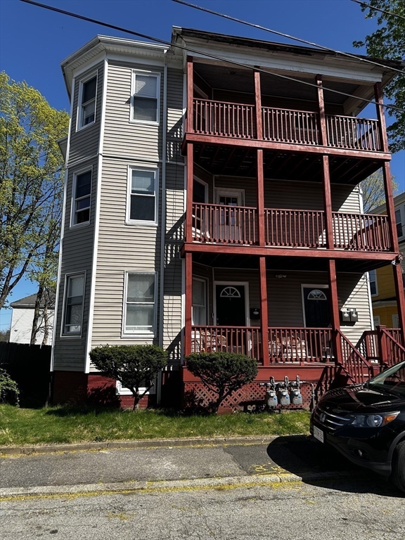 4 Howard Avenue, Unit 2 Attleboro, MA 02703 - Photo 17 of 17 a front view of a house with a yard