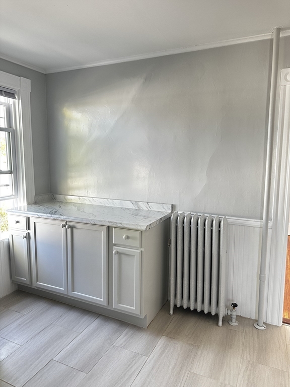 4 Howard Avenue, Unit 2 Attleboro, MA 02703 - Photo 3 of 17 an empty room with wooden floor and windows