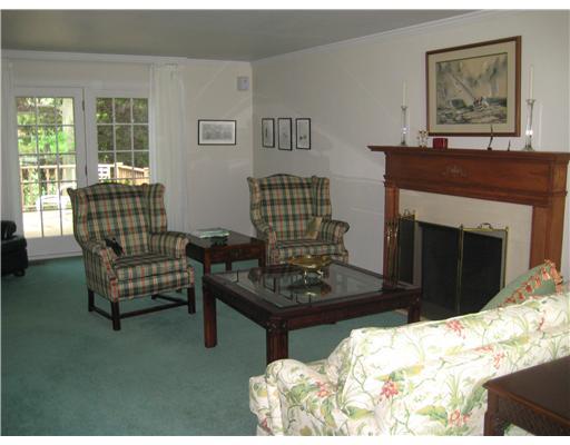 114 White Gate Road Pittsburgh, PA 15238 - Photo 8 of 18 Living Room. Large bright room with large window and patio door that opens out to rear deck area. A large mantle with wood mouldings and log-burning fireplace highlight the room.