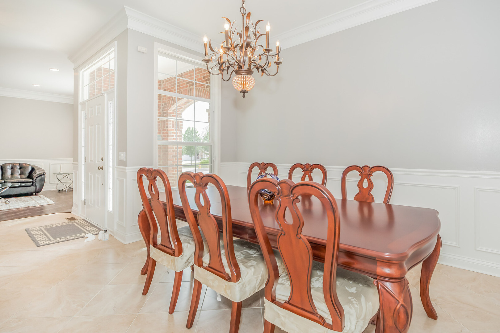 1115 Ashley Lane Inverness, IL 60010 - Photo 11 of 50 a view of a dining room with furniture and chandelier
