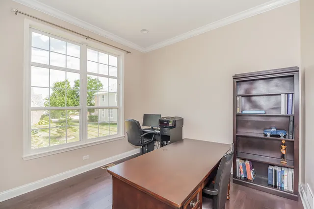 a view of a room with furniture and a window
