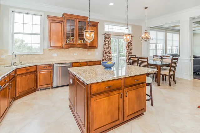 a kitchen with stainless steel appliances granite countertop counter space a sink and cabinets