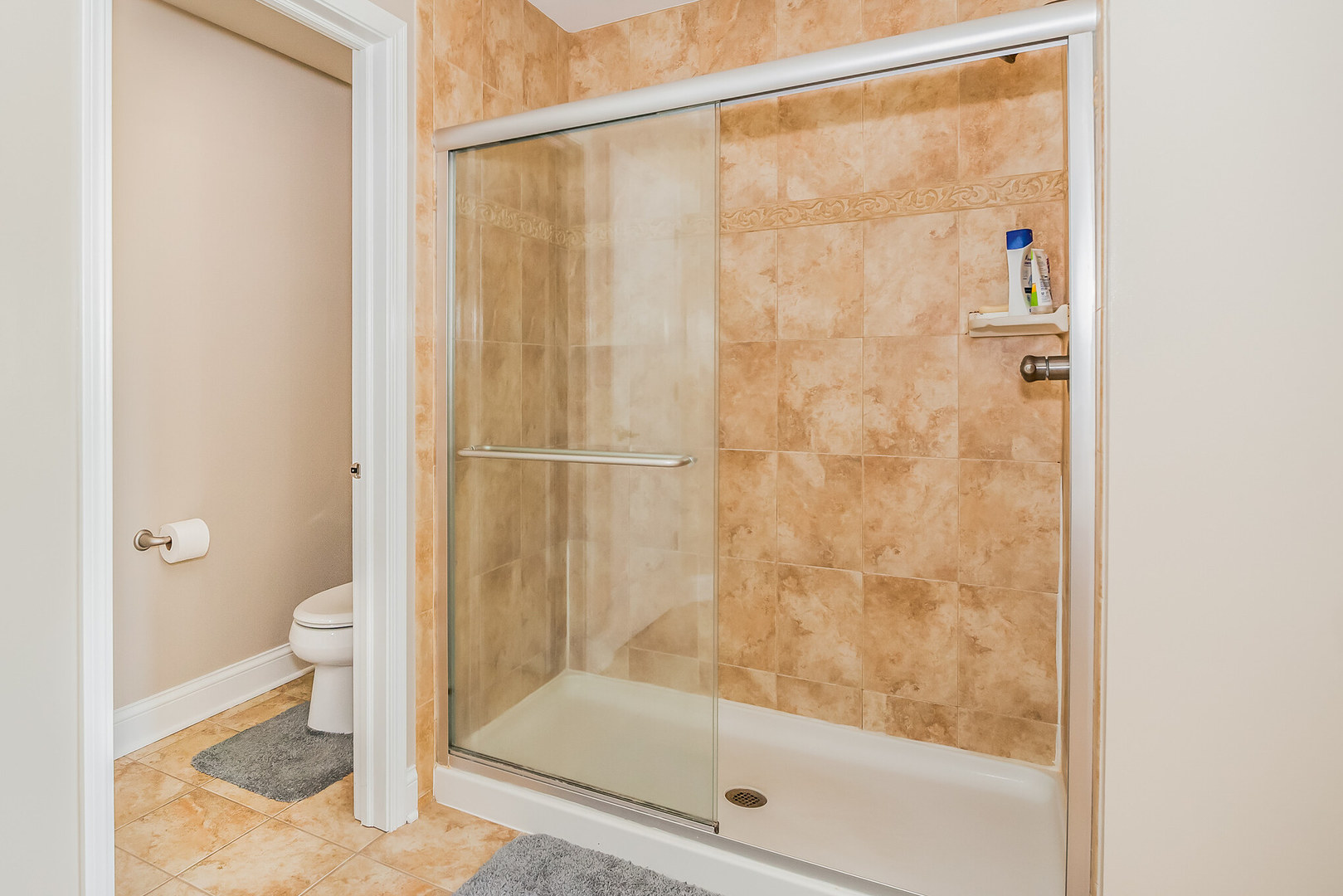 1115 Ashley Lane Inverness, IL 60010 - Photo 34 of 50 a bathroom with a shower and a toilet