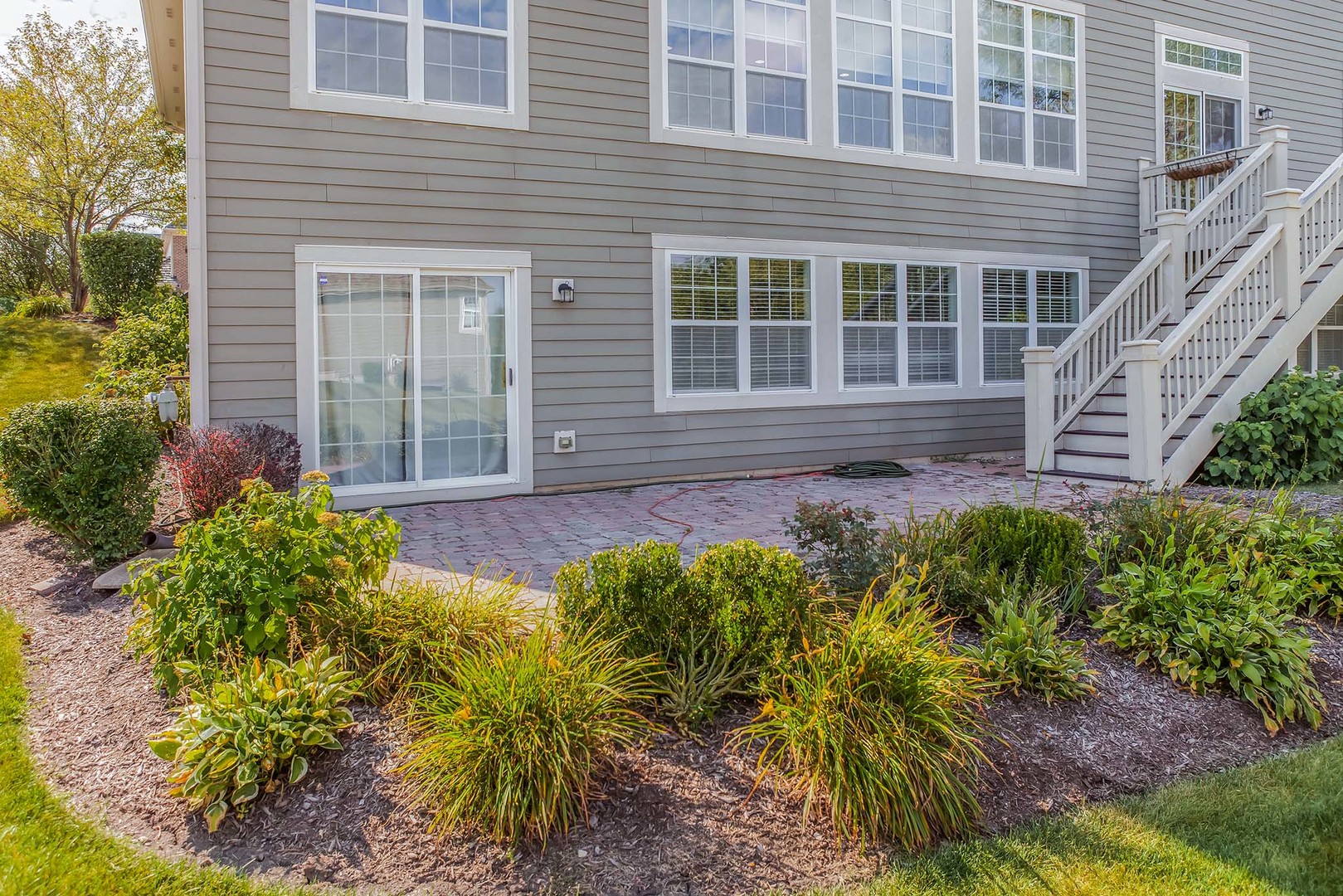 1115 Ashley Lane Inverness, IL 60010 - Photo 49 of 50 a front view of a house with garden