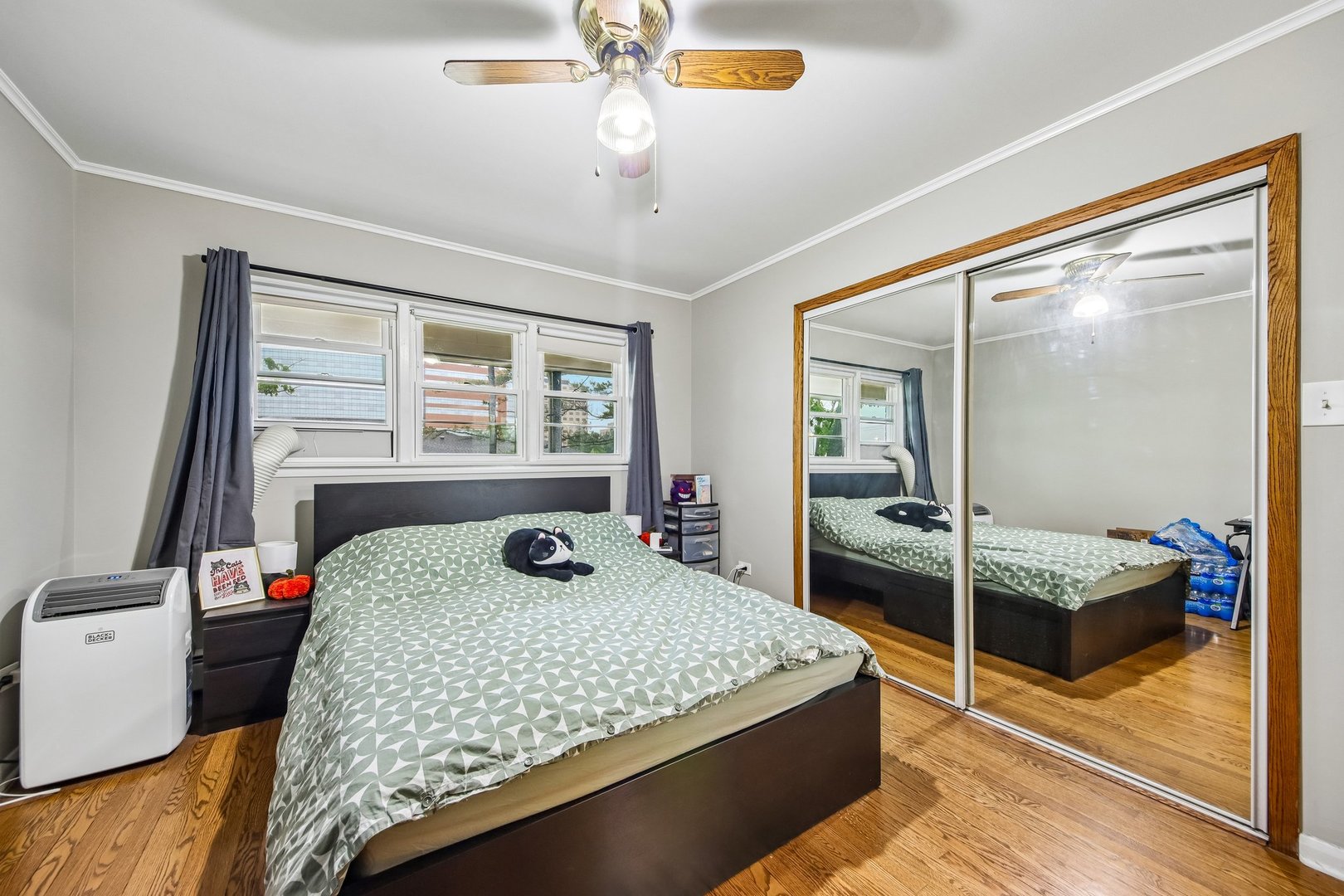 1855 Parkside Drive, Unit 8 Park Ridge, IL 60068 - Photo 14 of 22 a bedroom with a bed and large window