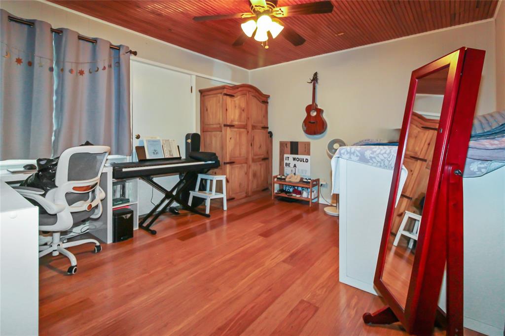 1001 Sandy Ridge Road Scurry, TX 75158 - Photo 25 of 35 Room featuring wood-finish flooring and a wood-paneled ceiling