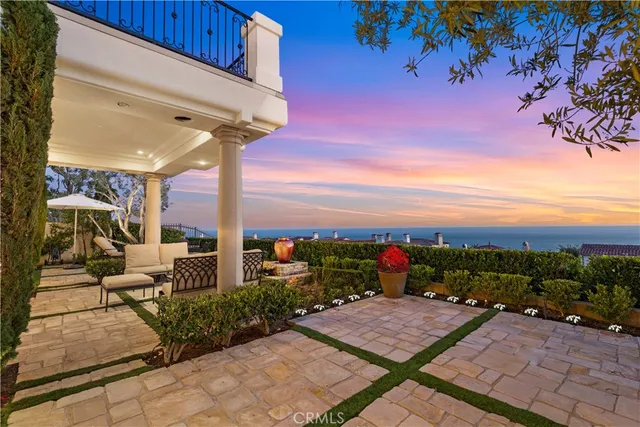 a view of a table and chairs under an umbrella