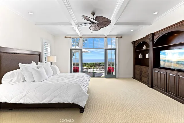 a view of a hallway with wooden floor and entryway
