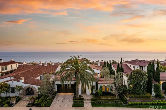 a front view of a house with lots of yellow lighting