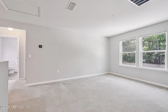a front view of a house with yard patio and green space