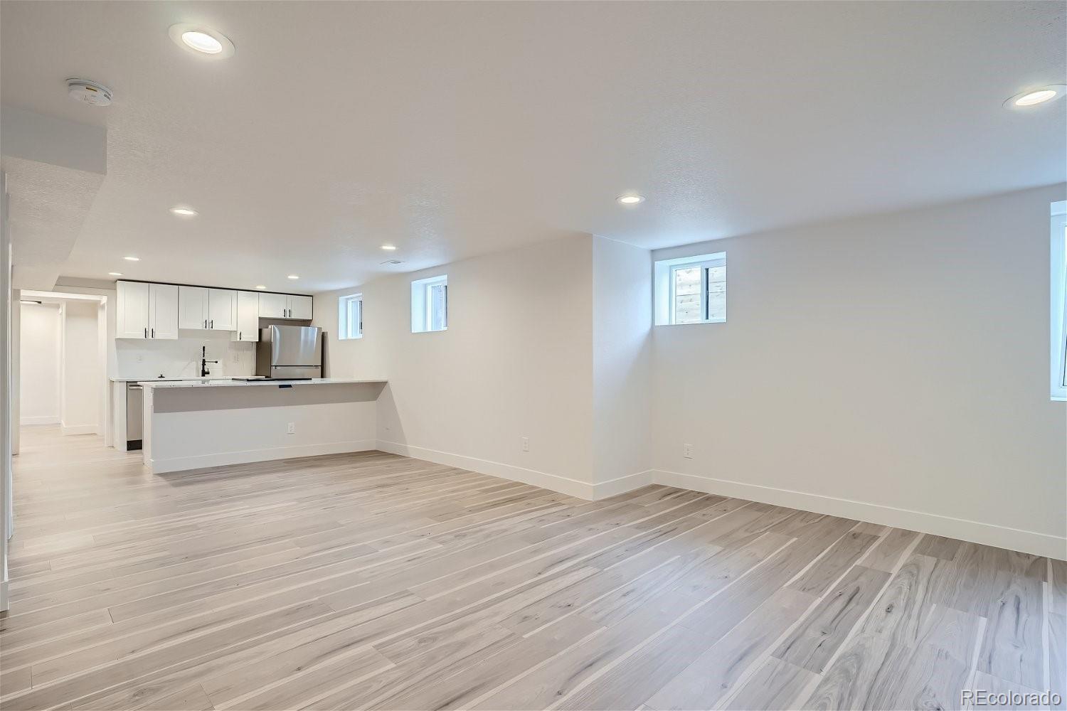 1400 Perry Street Denver, CO 80204 - Photo 17 of 26 a view of kitchen and wooden floor