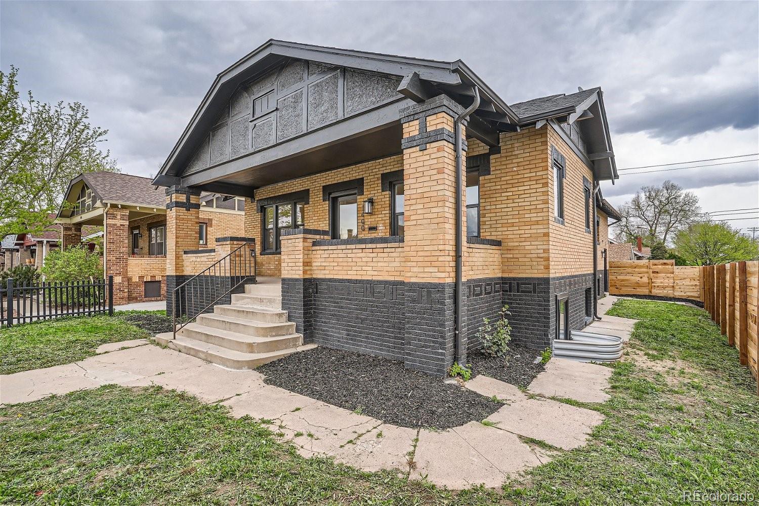 1400 Perry Street Denver, CO 80204 - Photo 2 of 26 a front view of a house with a yard
