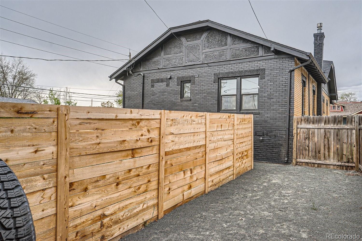 1400 Perry Street Denver, CO 80204 - Photo 25 of 26 a view of a wooden house with a large door