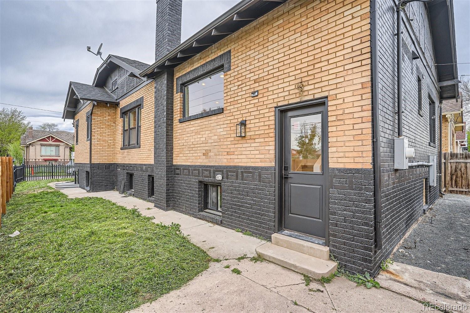 1400 Perry Street Denver, CO 80204 - Photo 26 of 26 a front view of a house with garage