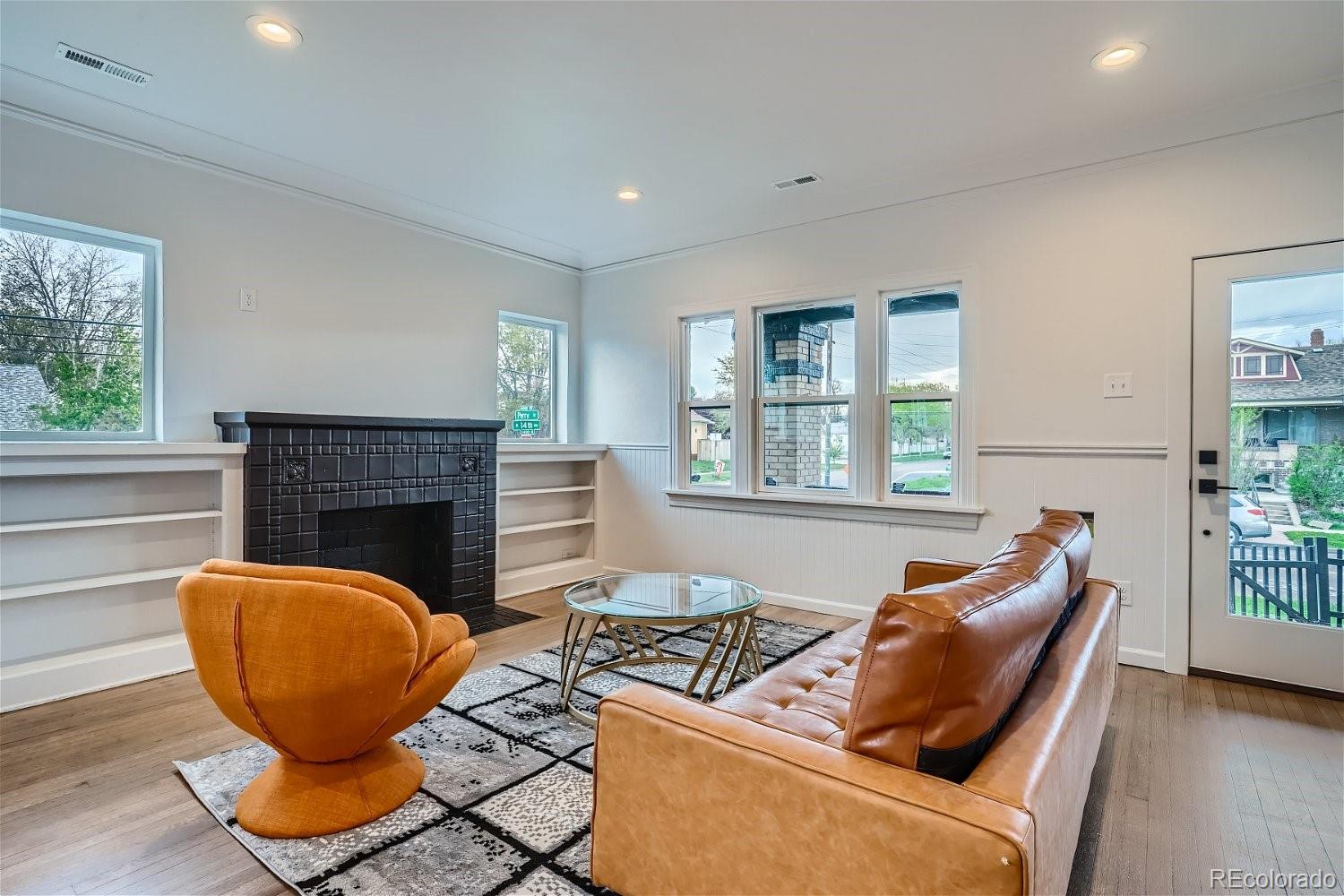 1400 Perry Street Denver, CO 80204 - Photo 7 of 26 a living room with furniture and a fireplace