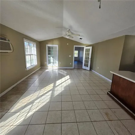 a view of an empty room and window
