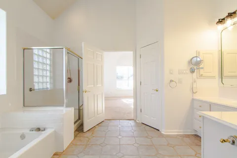 a bathroom with a bathtub and shower