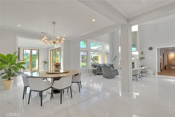 a large white kitchen with a large window