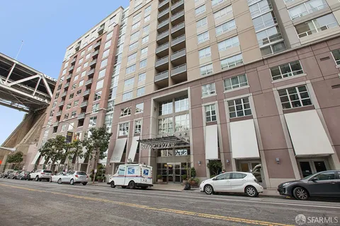 a view of a building and car parked