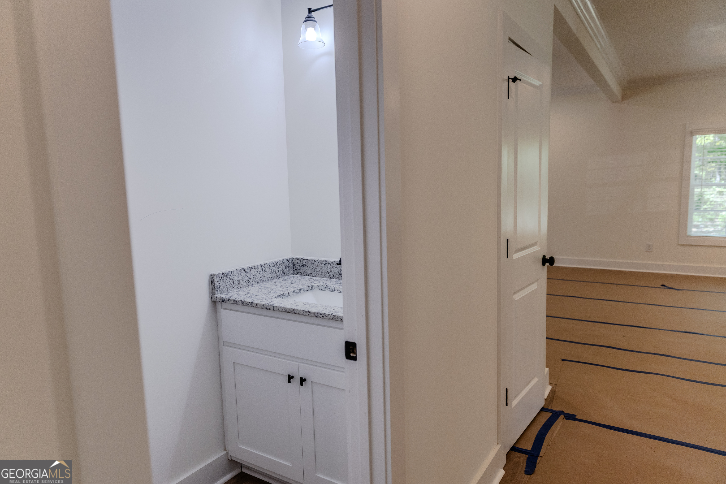 632 Campbell Road Covington, GA 30014 - Photo 15 of 60 a bathroom with a granite countertop sink and a mirror