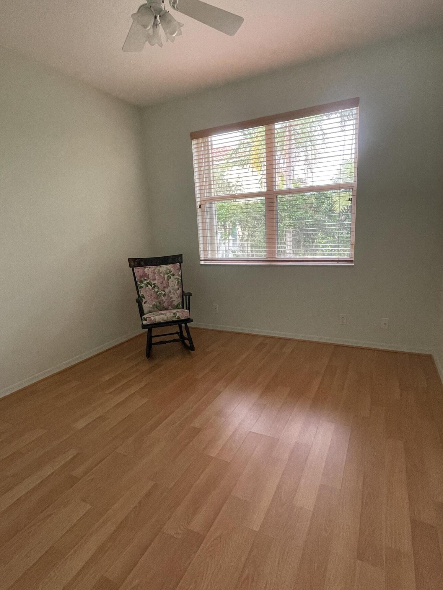 22324 Rushmore Place Boca Raton, FL 33428 - Photo 13 of 33 wooden floor in an empty room with a window