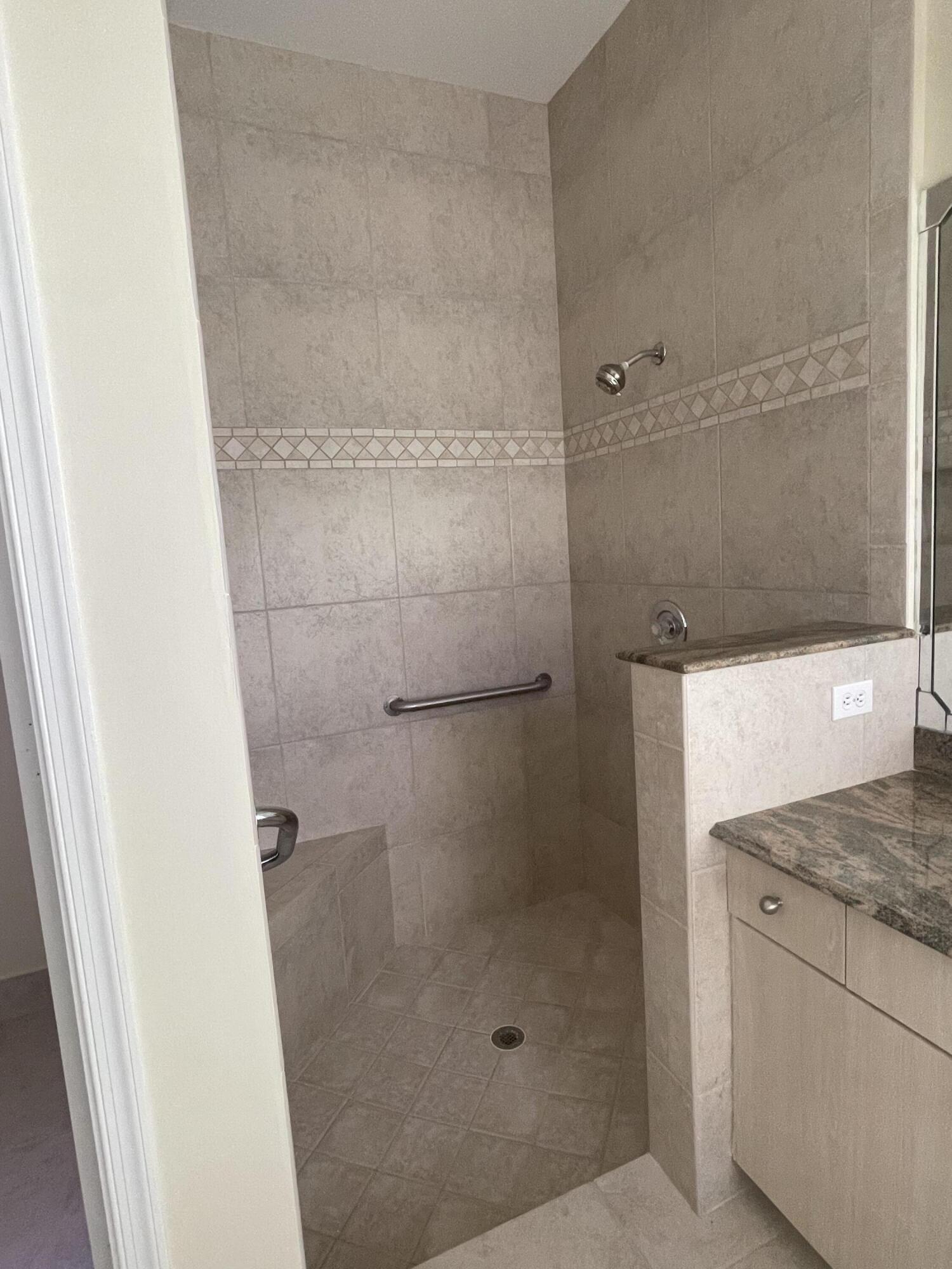 22324 Rushmore Place Boca Raton, FL 33428 - Photo 22 of 33 a bathroom with a granite countertop shower and a sink