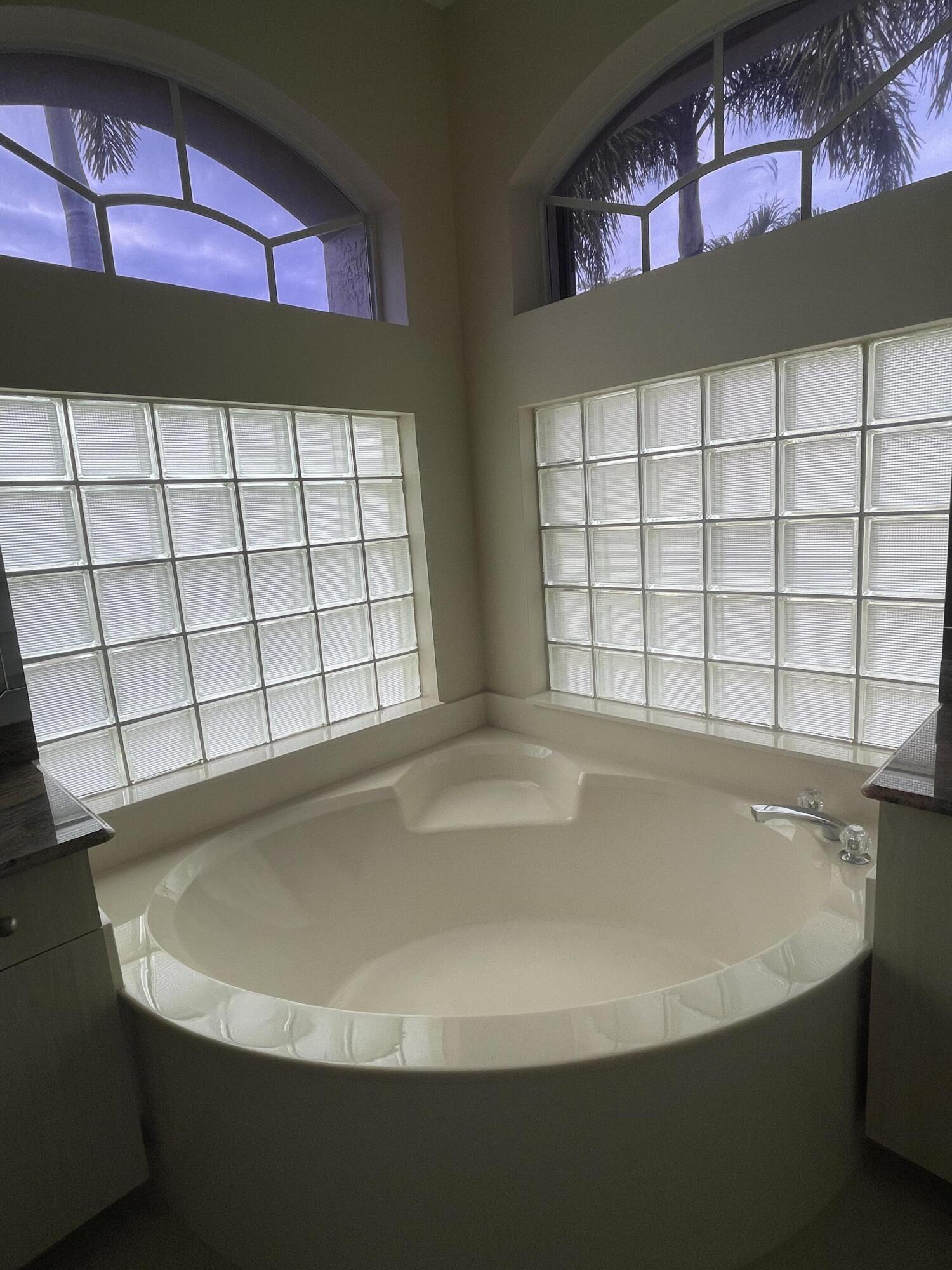22324 Rushmore Place Boca Raton, FL 33428 - Photo 24 of 33 a view of a bathtub in a room
