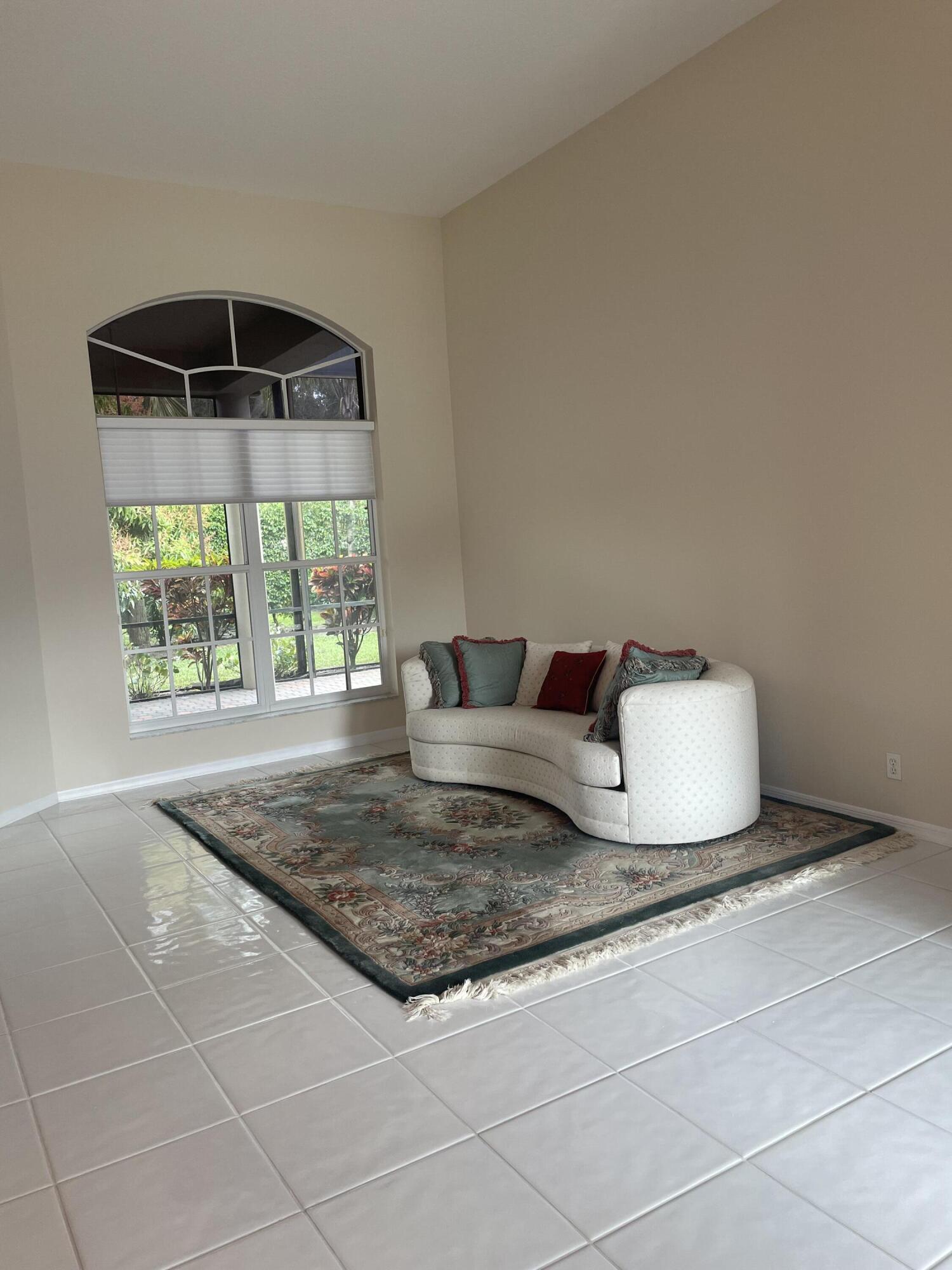 22324 Rushmore Place Boca Raton, FL 33428 - Photo 3 of 33 a bedroom with a bed and a window