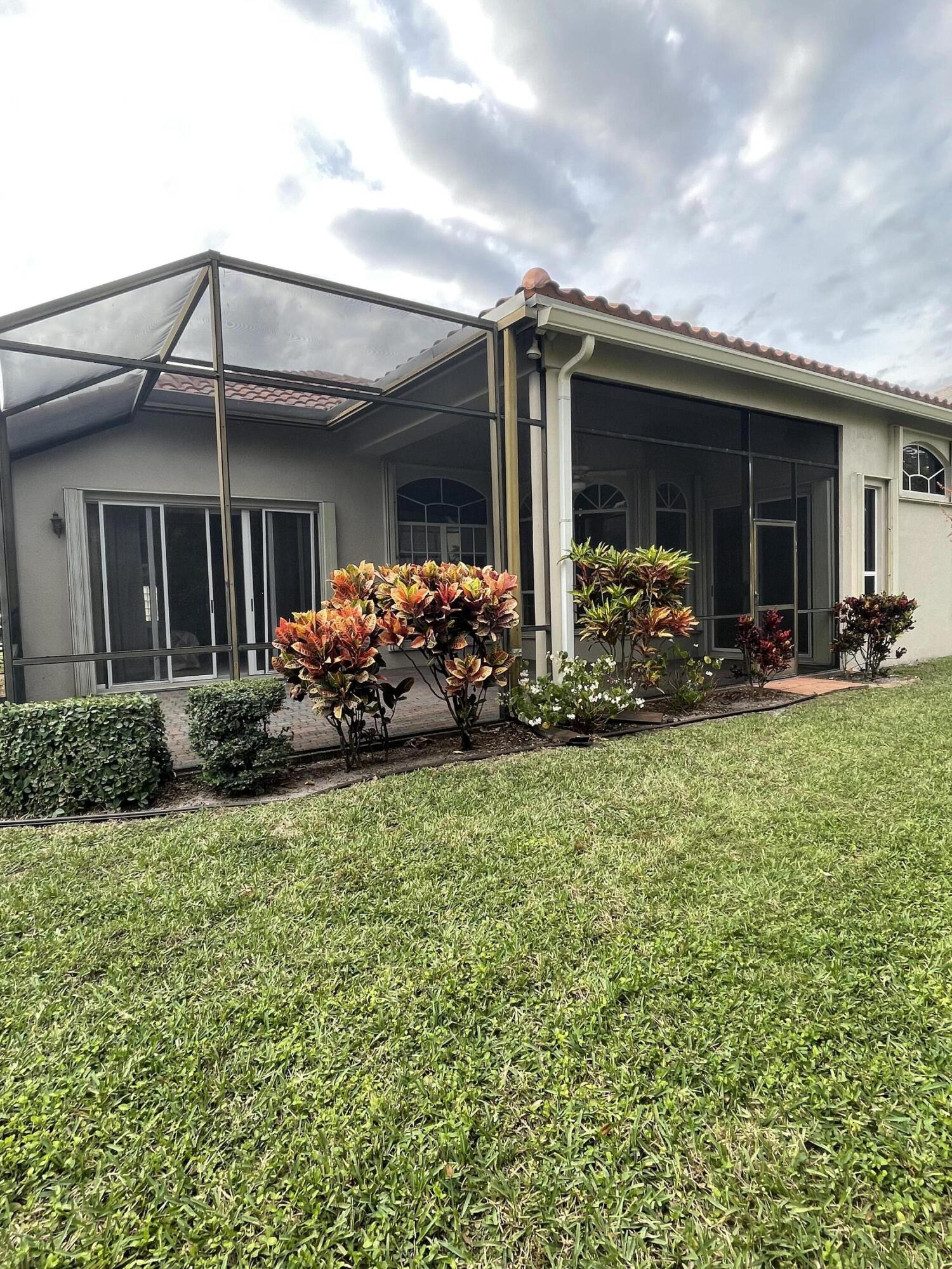 22324 Rushmore Place Boca Raton, FL 33428 - Photo 33 of 33 a front view of house with yard outdoor seating and garage