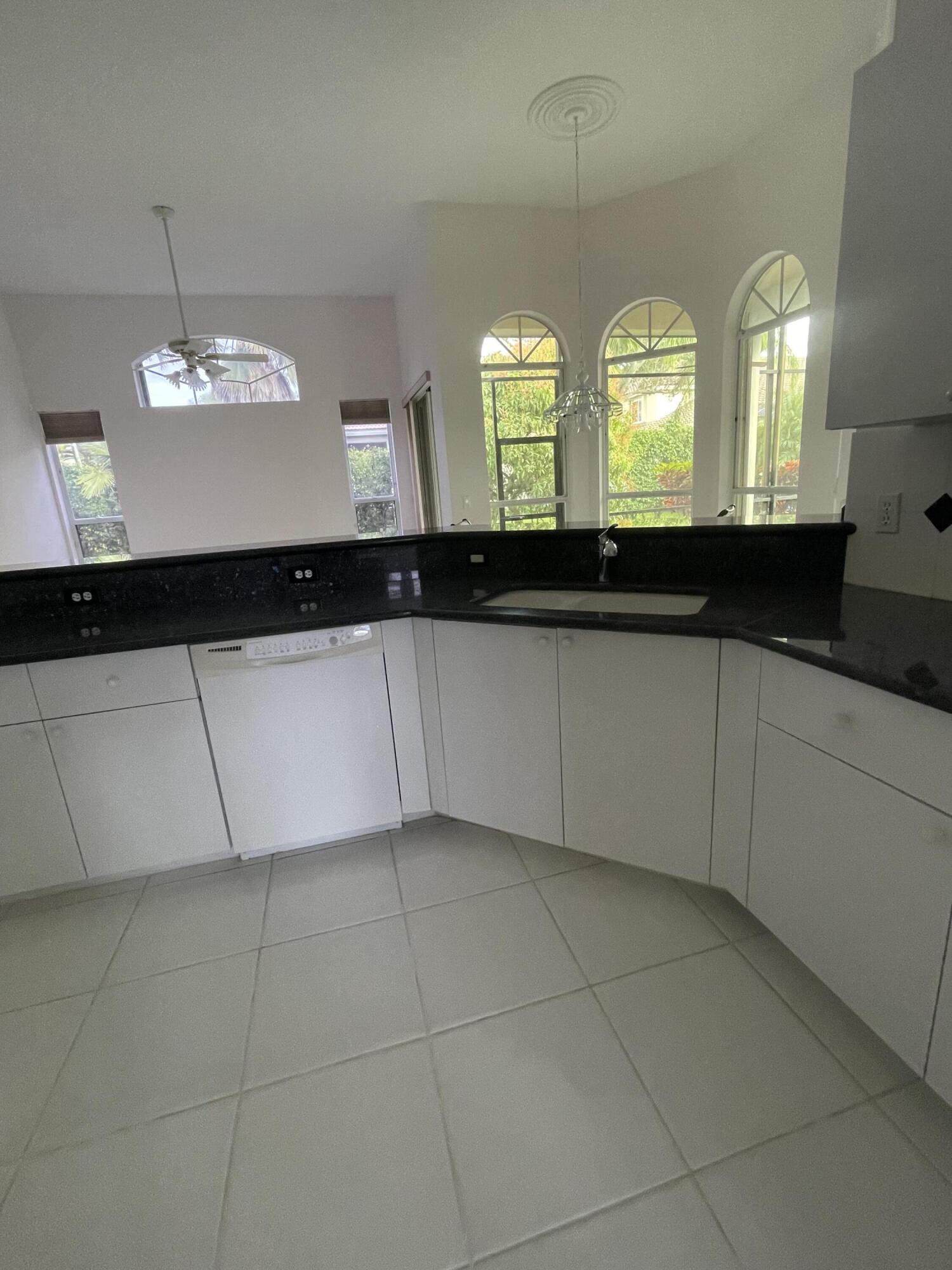 22324 Rushmore Place Boca Raton, FL 33428 - Photo 10 of 33 a view of a bathroom with double vanity and a two mirror