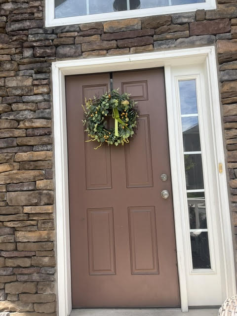 2212 Rising Hill Road Whitehall, PA 18052 - Photo 2 of 21 A welcoming entry, adorned with a festive wreath, beckons visitors into this charming residence.