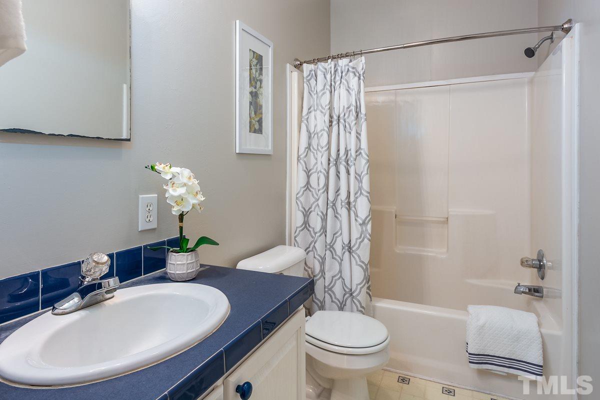 3882 Millard Whitley Road Chapel Hill, NC 27516 - Photo 16 of 20 a bathroom with a sink toilet and shower