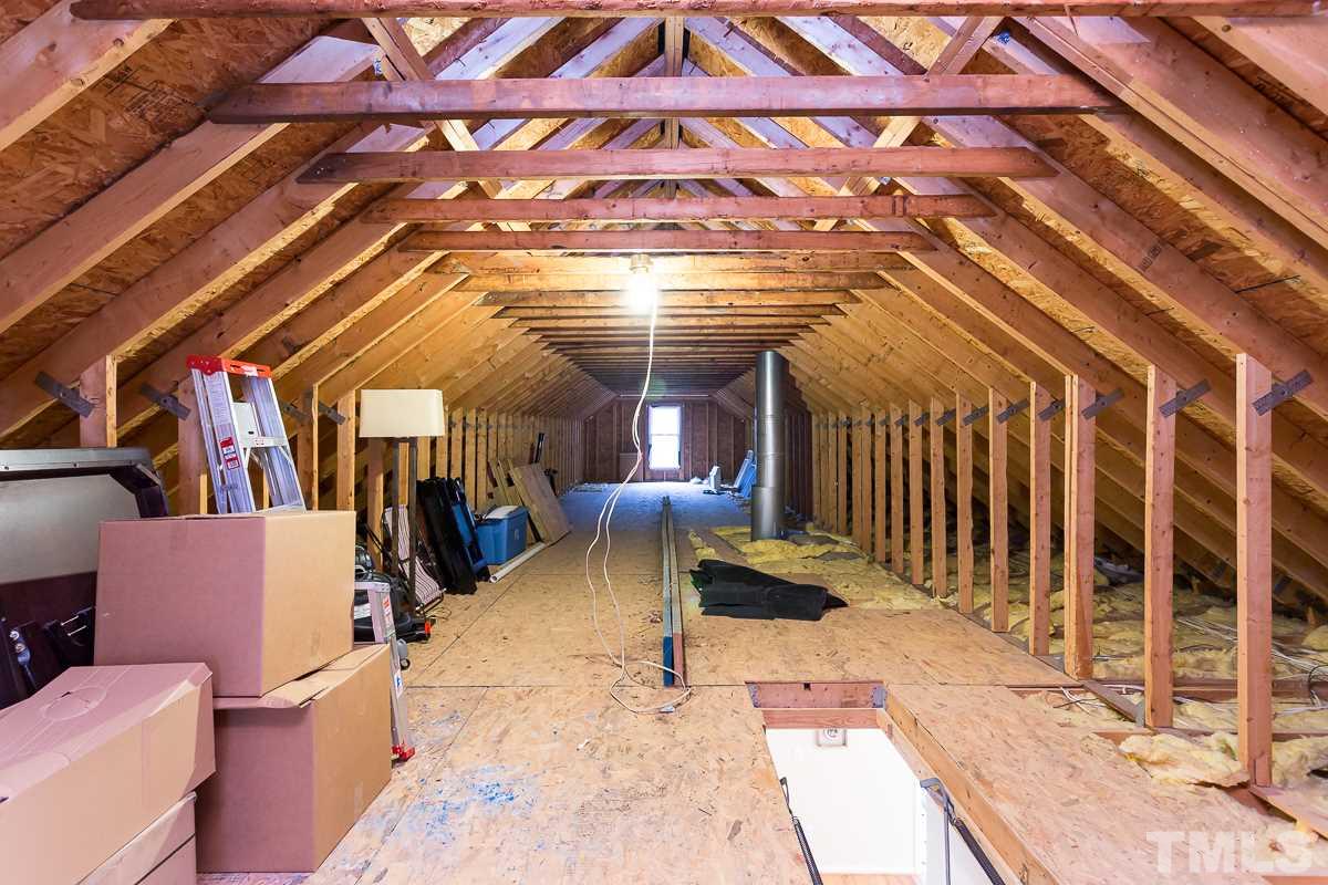 3882 Millard Whitley Road Chapel Hill, NC 27516 - Photo 17 of 20 a view of a patio with a table and chairs