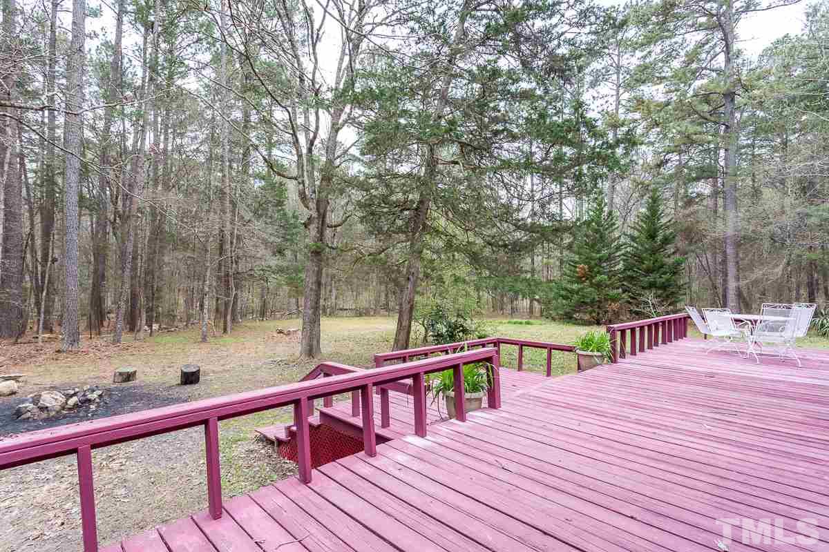 3882 Millard Whitley Road Chapel Hill, NC 27516 - Photo 18 of 20 a view of a deck with chairs and wooden floor
