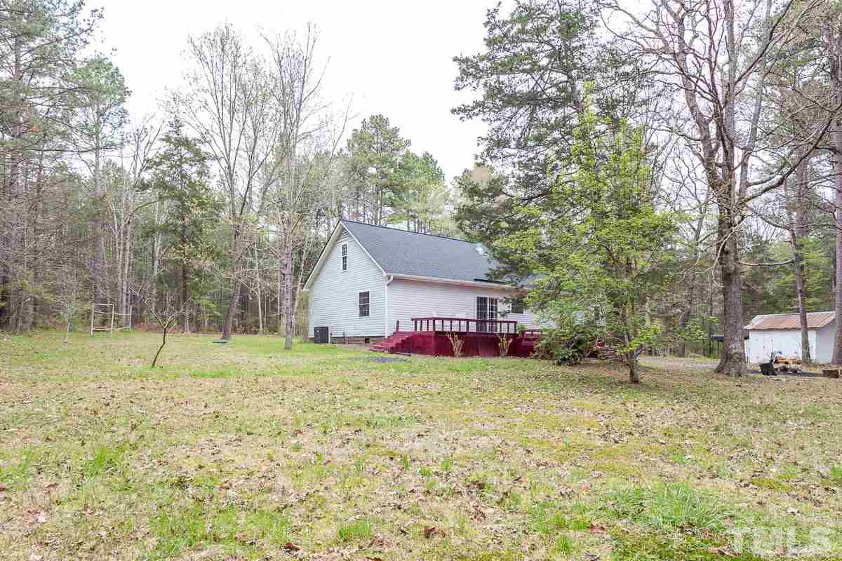 3882 Millard Whitley Road Chapel Hill, NC 27516 - Photo 20 of 20 a view of a house with a yard and trees