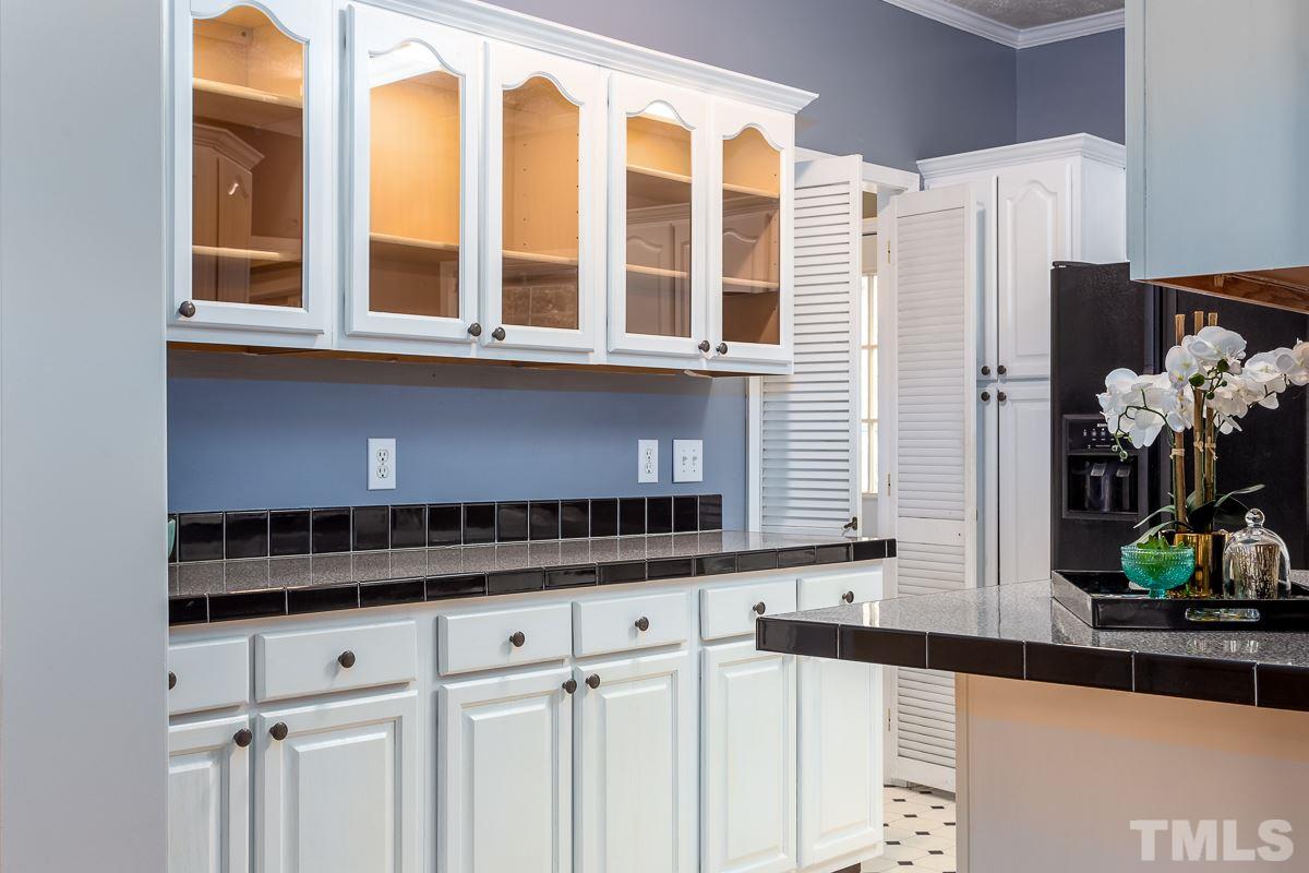 3882 Millard Whitley Road Chapel Hill, NC 27516 - Photo 7 of 20 a kitchen with stainless steel appliances granite countertop a stove and a sink