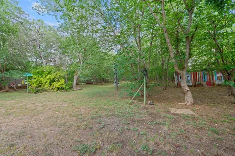 a backyard of a house with lots of green space