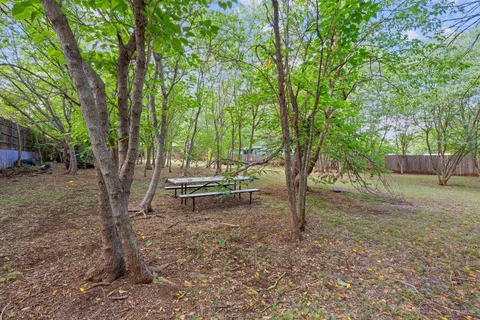 a backyard of a house with lots of green space