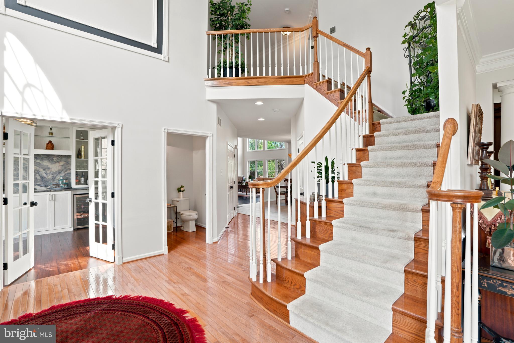 2303 Redtail Road Norristown, PA 19403 - Photo 7 of 53 a view of staircase with lots of frames on wall and a window