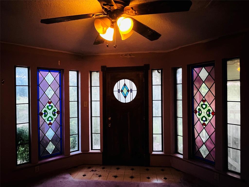701 County Road 319 Early, TX 76802 - Photo 7 of 33 Entrance foyer featuring a ceiling fan, plenty of natural light, and a textured ceiling