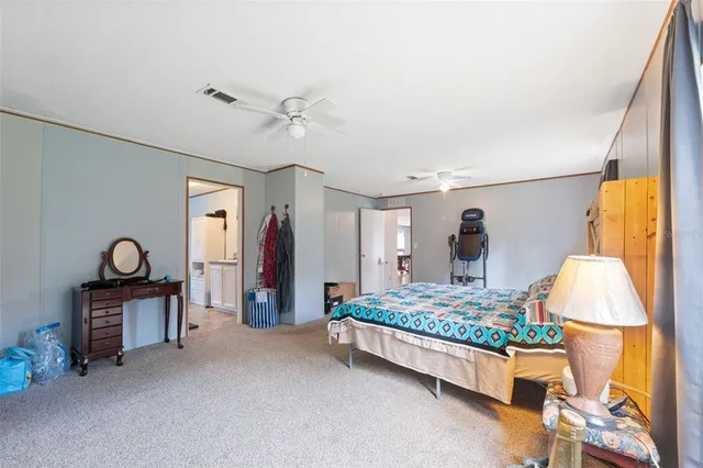 a bathroom with a tub and toilet