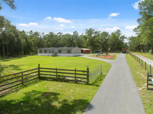 a view of a swimming pool with a lounge chairs