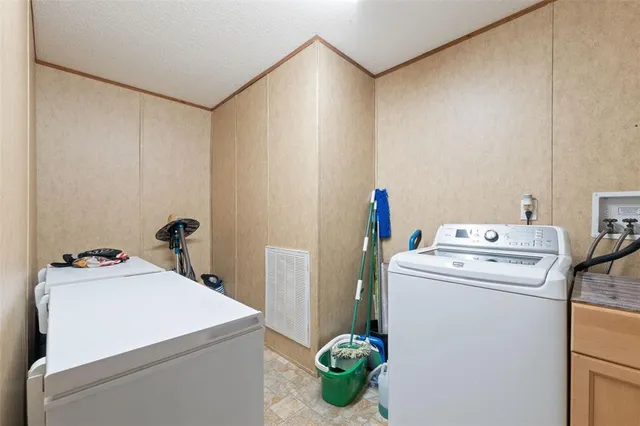 a view of a chairs and table in a patio