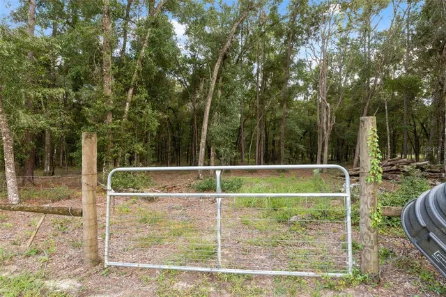 a view of a chairs with a small yard and a fountain
