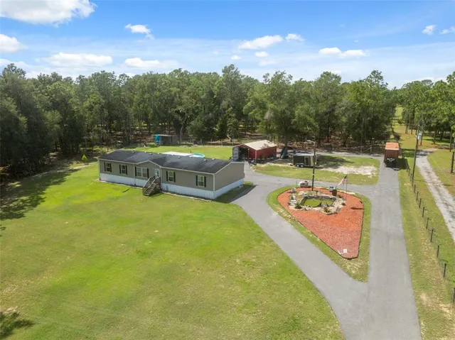 a view of a swimming pool and an outdoor space