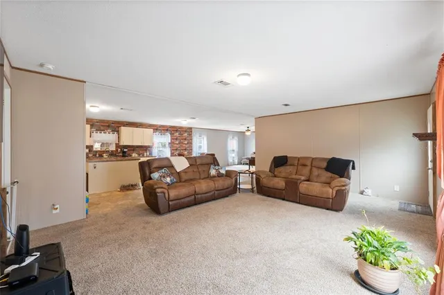 a living room with furniture and flowers