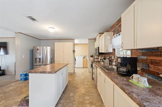 a large kitchen with lot of counter space